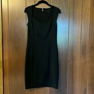 Fitted black dress with unique neckline